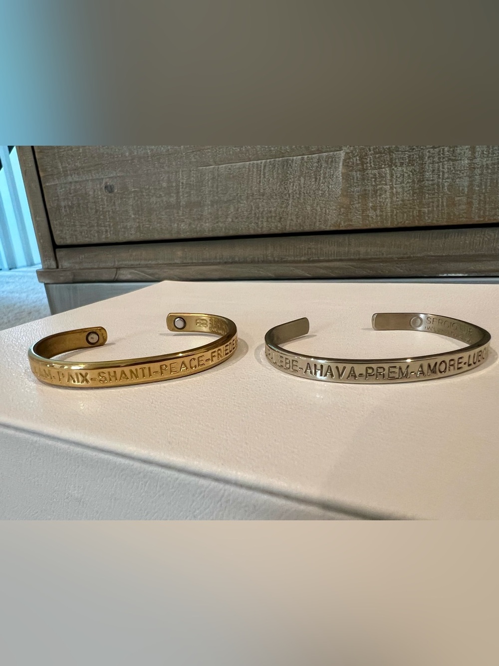 Sergio Lub gold tone “peace” and silver tone “love” cuff bracelets, extra small